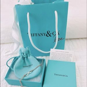 Tiffany & Co sterling silver infinity bracelet symbolizing powerful connection.